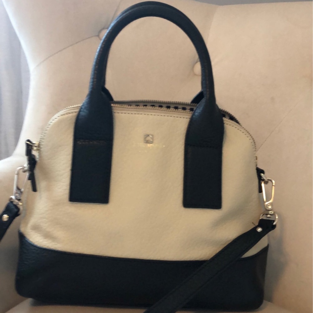 Kate Spade pebbled leather satchel style purse with dome top. Cream and black.